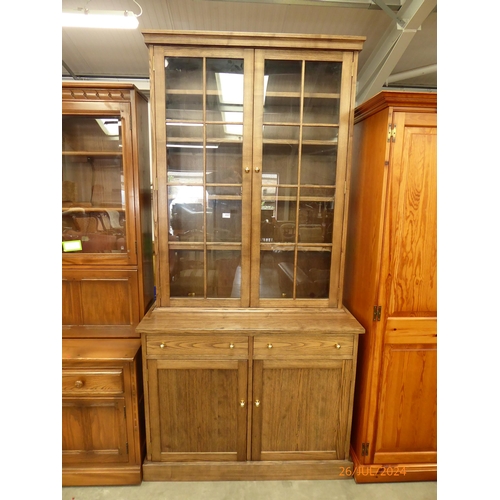 2327 - A modern oak and glazed kitchen cabinet