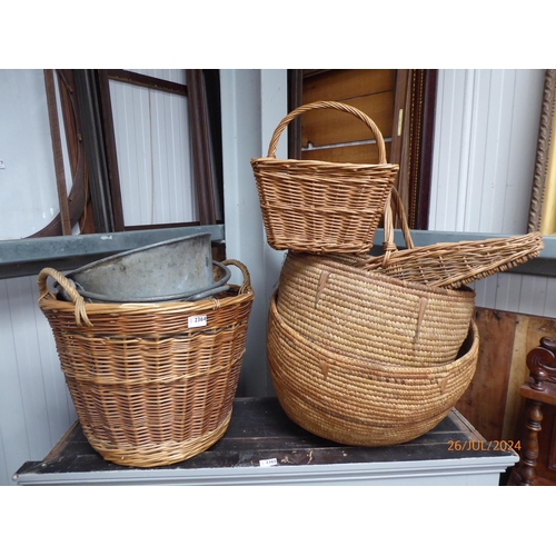 2364 - A galvanised coal scuttle together with wicker log baskets and wicker picnic carrier (6)