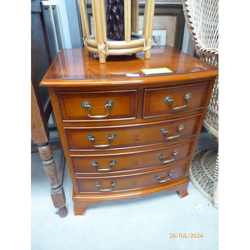 2418 - A reproduction Georgian bow fronted chest of two short over three long drawers, outswept bracket fee... 