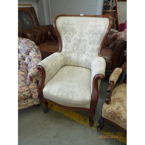 2442 - A Victorian mahogany framed spoon back arm chair