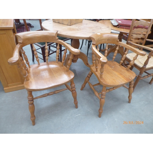 2304 - A pair of beech Captain's chairs