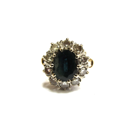 6060 - A sapphire and diamond cluster ring, the central sapphire 10mm x 7mm, framed by ten round cut diamon... 