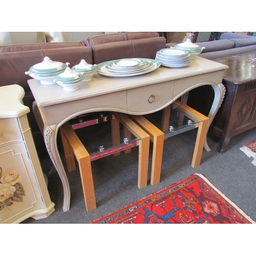 1148 - A French 19th Century style single drawer painted console table having a shaped apron over carved fl... 