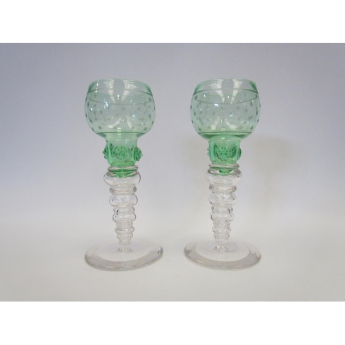 1416 - A pair of tall star cut Victorian green and white hock glasses, 18.5cm tall