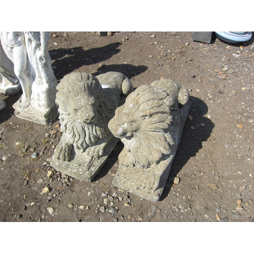 3570 - A pair of composition recumbent lions