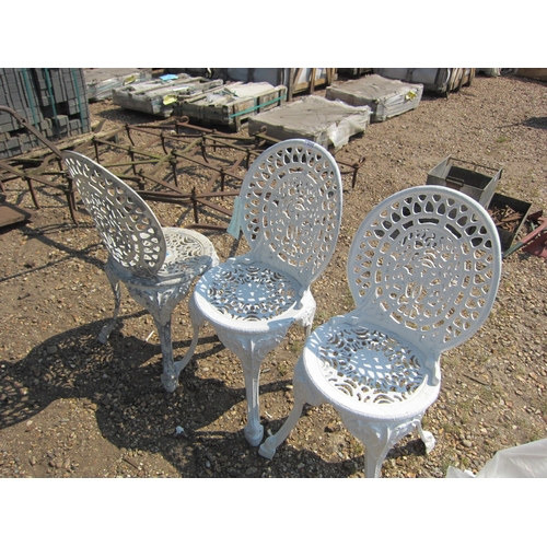 3598 - Three cast alloy garden chairs