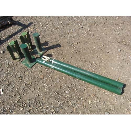 3599 - A pair of tennis net posts and four post holders