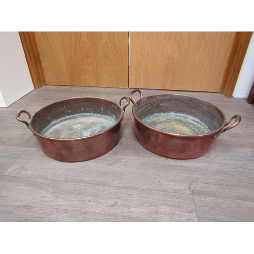 6037 - Two 19th Century large twin handled copper pans, 48cm diameter