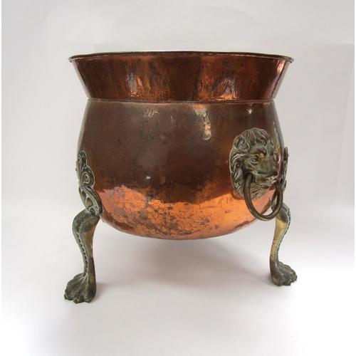 6038 - A 19th Century copper coal bin with lion mask ring handles raised on paw feet