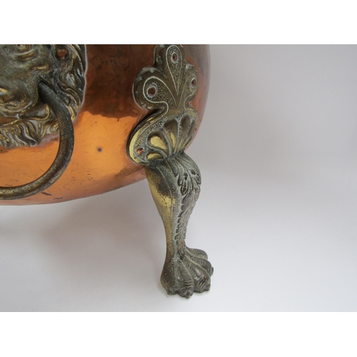 6038 - A 19th Century copper coal bin with lion mask ring handles raised on paw feet