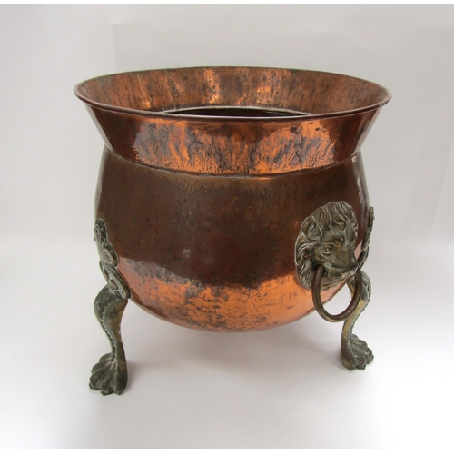 6038 - A 19th Century copper coal bin with lion mask ring handles raised on paw feet