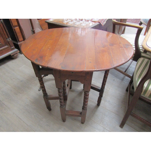 6102 - An oak drop-leaf occasional table with bobbin turned legs, 72cm x 72cm x 58cm