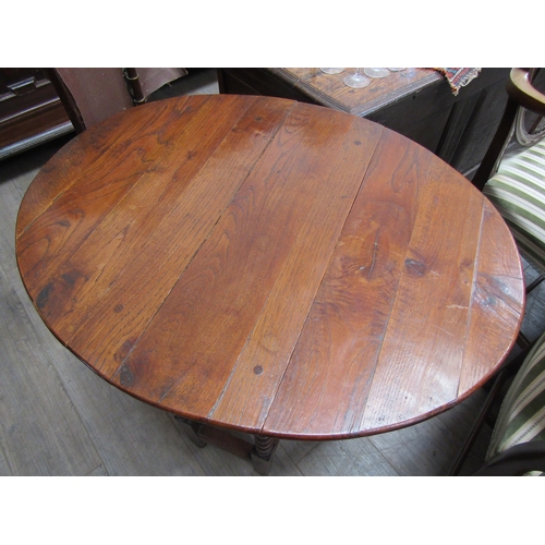 6102 - An oak drop-leaf occasional table with bobbin turned legs, 72cm x 72cm x 58cm