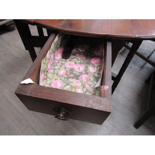 6102 - An oak drop-leaf occasional table with bobbin turned legs, 72cm x 72cm x 58cm