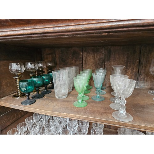 6054 - Twenty four 19th Century and later mixed drinking glasses including Hock, coloured glass, fern tall ... 