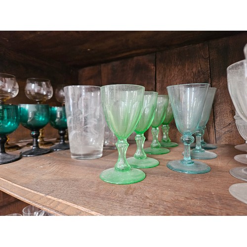 6054 - Twenty four 19th Century and later mixed drinking glasses including Hock, coloured glass, fern tall ... 