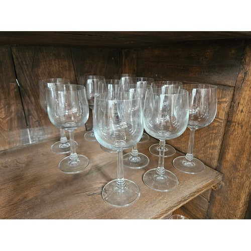 6054A - Eleven tall wine glasses with facet stem to ring turned base, 19cm tall