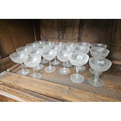 6056 - Fourteen Edwardian matching champagne saucers and six others