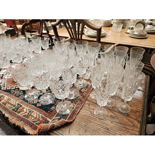 6107 - Suite of crystal glasses including champagne flutes, red wine, white wine, tumblers (71)