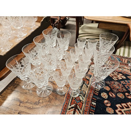 6107 - Suite of crystal glasses including champagne flutes, red wine, white wine, tumblers (71)