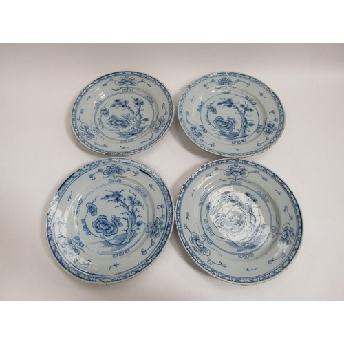 6013 - Four 18th Century tin glazed plates, possibly Delft, all with tree and flower pattern. Chipping pres... 