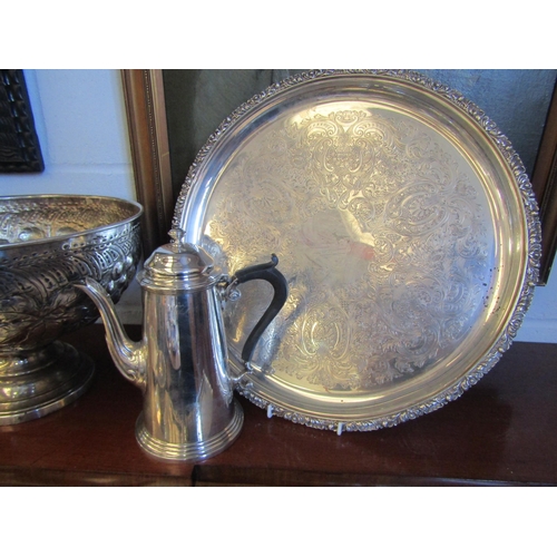 1017 - A selection of silver plate and metalware. A basin, a pair of café-au-lait, six trays and a repousse... 