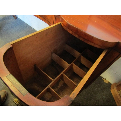 1018 - A Regency mahogany sideboard, shaped front with two central drawers and a pair of convex drawers on ... 