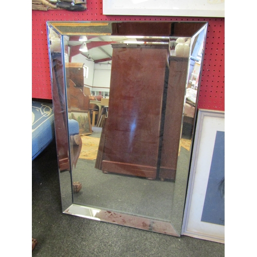 1045 - A framed bevel edged wall mirror, 91cm x 61cm