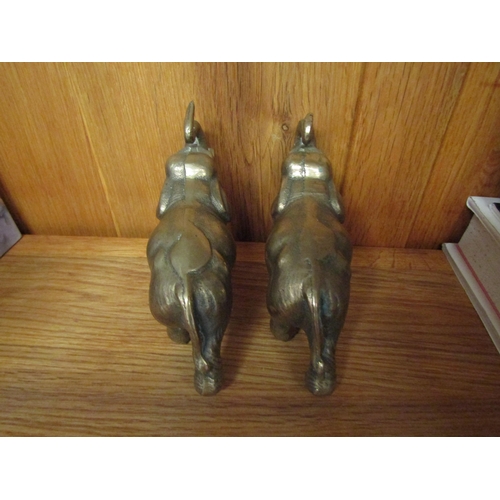 1054 - A pair of heavy brass elephant figures, 10cm tall