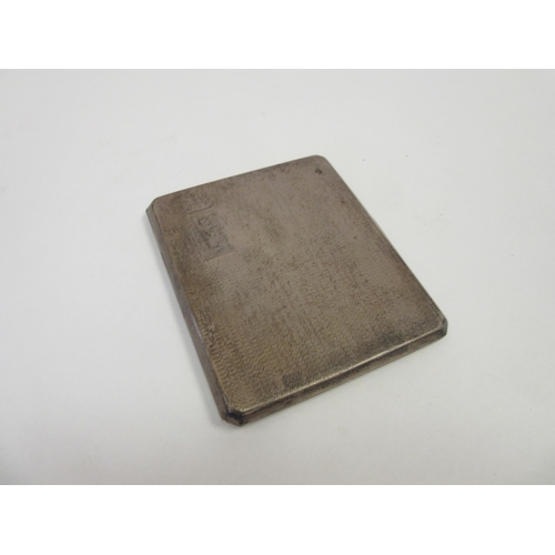 1369 - A silver cigarette case, engine turned, monogrammed cartouche