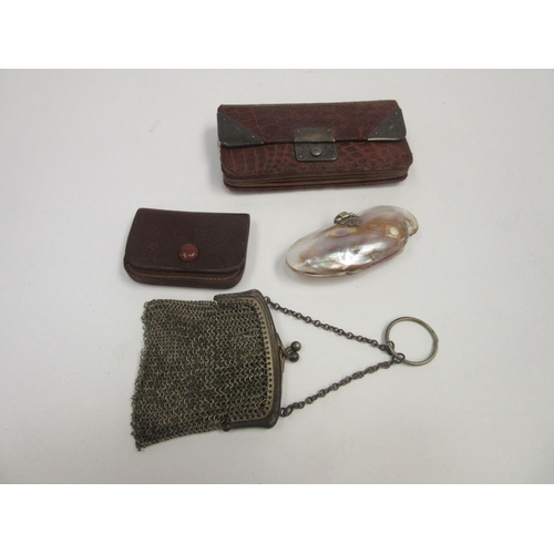 1378 - A crocodile purse, silver mounts, Chester, A French white metal purse, a miniature leather purse and... 