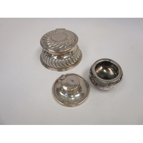 1393 - Two silver capstan inkwells, one with wrythen decoration