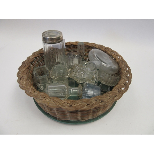 1418 - A basket of miscellaneous glassware to include cut glass knife rests, decanter stoppers, dressing ta... 