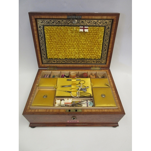 1428 - A Victorian sarcophagus sewing box with associated contents to include thimbles in treen acorn, leat... 