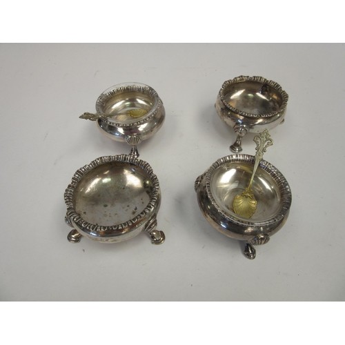 1437 - A pair of silver salts raised on three feet with original glass liners, Chester 1900 and a similar p... 