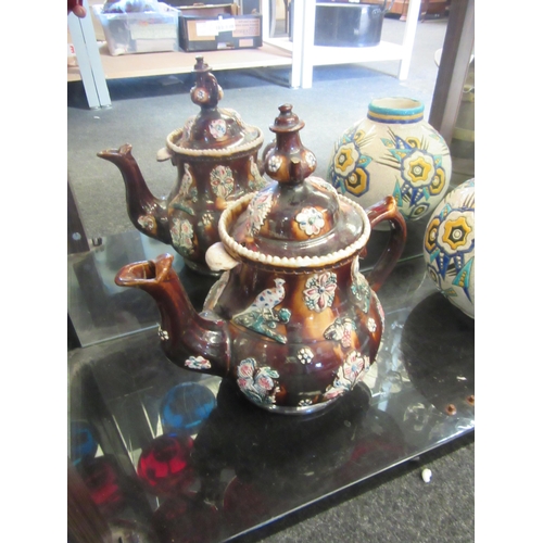 1492 - A Bargeware teapot of large proportions, raised relief of flowers, a/f