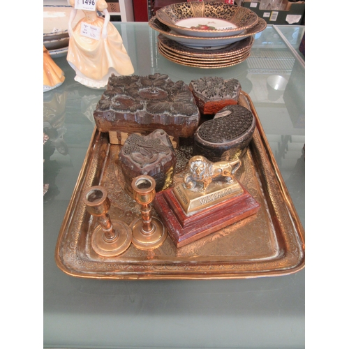 1499 - A rectangular brass tray with ornate decoration, four fabric stamps, brass lion on plinth marked 