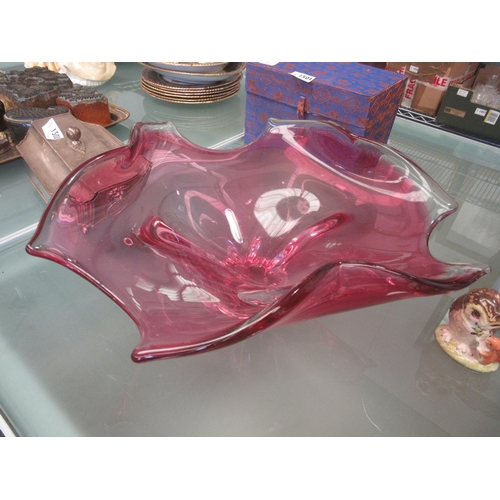 1502 - A large cranberry art glass 'splash' bowl, 36cm wide