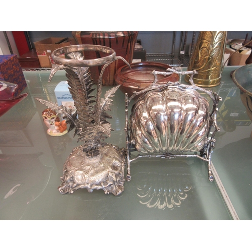 1505 - A silver plated biscuit warmer together with a fern design epergne stand, 27cm tall (2)