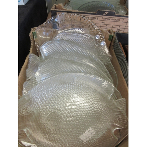 1534 - Two boxes containing large clear glass moulded fish form dishes in various sizes 39cm, 26cm and 16cm