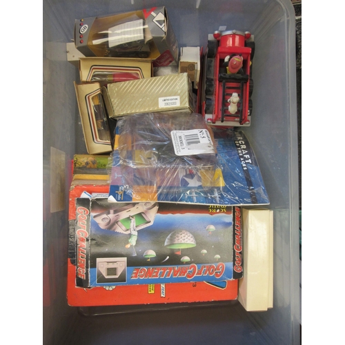 1537 - A box of die-cast vehicles including Corgi and Lledo, annuals, etc.