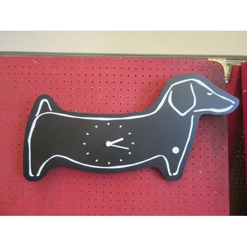 1056 - A wall hanging clock in the form of a Dachshund, 52cm long