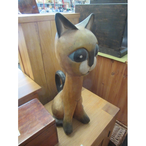 1096 - A large wooden seated cat figure, 52cm tall