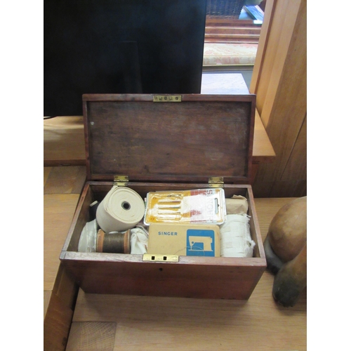 1097 - A mahogany sewing box with contents