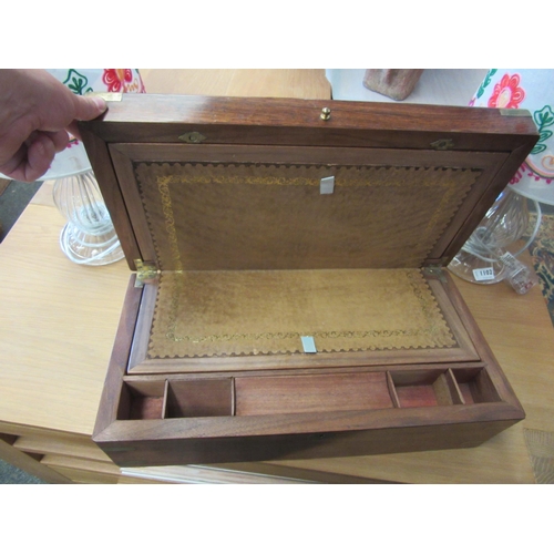 1103 - A Victorian mahogany campaign style writing box with brass mounts, tooled brown leather insert