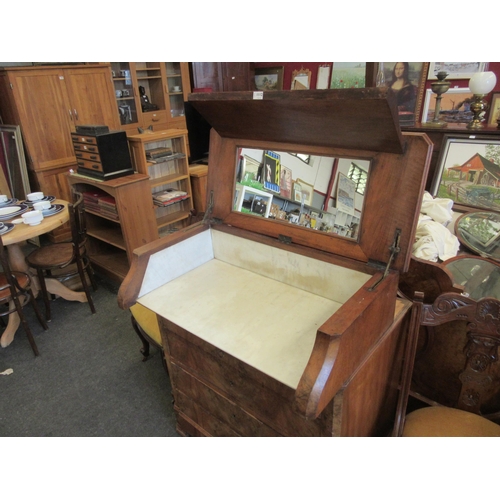 1112 - A 19th Century French walnut dressing chest, sliding top opening to reveal a marble and mirrored int... 