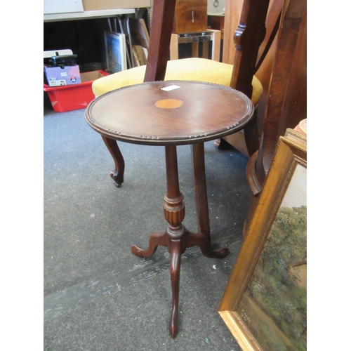 1114 - A pair of mahogany tripod wine tables with fan inlay, 52cm x 30cm diameter