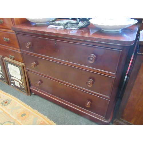 1133 - A Victorian mahogany three drawer chest on turned feet with rounded corners, 94cm tall x 110cm wide ... 