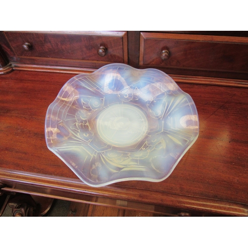 1145 - An opalescent glass bowl with floral design and frilled edge, 24cm diameter