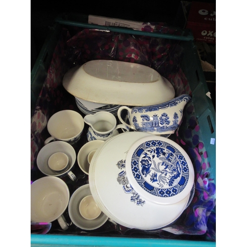 1158 - Two boxes of blue and white ceramics, mainly Willow pattern including tea cosy and place mats